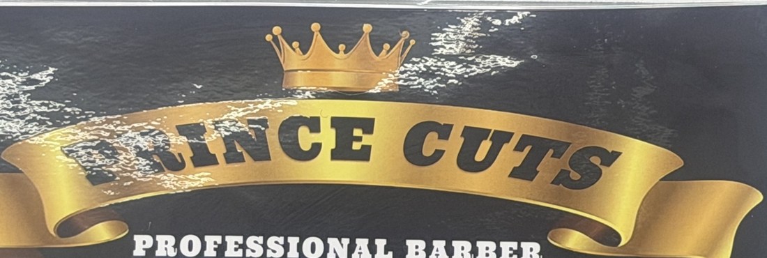 Prince Cuts gold crown and ribbon sign